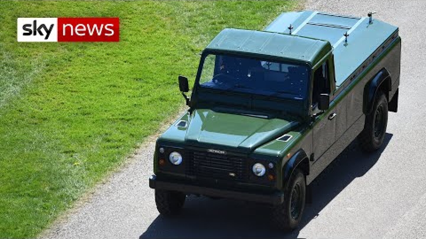 Prince Philip's custom-built Land Rover arrives at Windsor Castle before collecting his coffin.