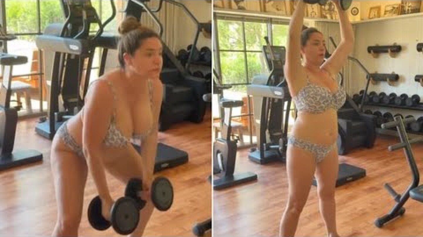 Kelly Brook lifts weights in her bikini while on a wellness retreat with her husband Jeremy Parisi