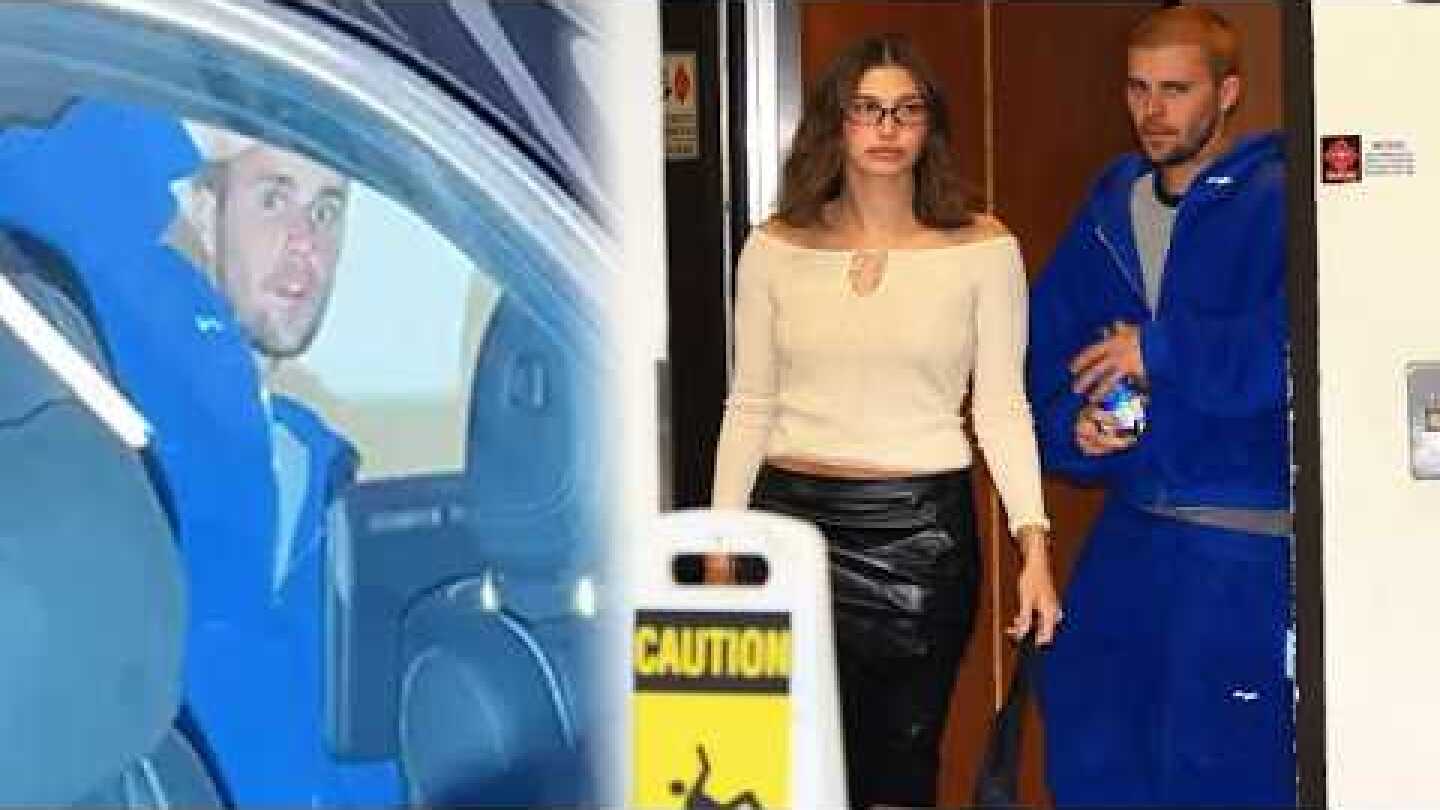 Justin Bieber caught on camera throwing water bottle at photographer during tense exit with Hailey