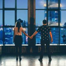 man and woman holding hands