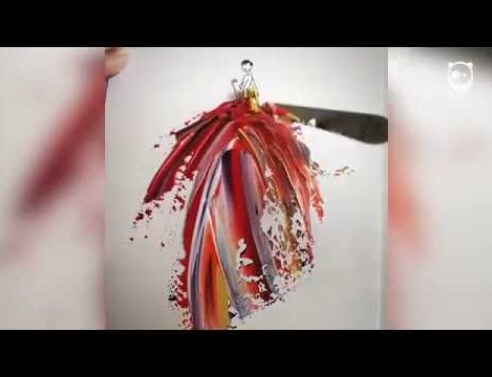 Artist uses paint and water drops to create spontaneous dress designs