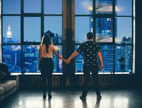 man and woman holding hands