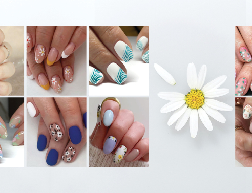 Γυναικεία χέρια με βαμμένα νύχια και σχέδια λουλούδια